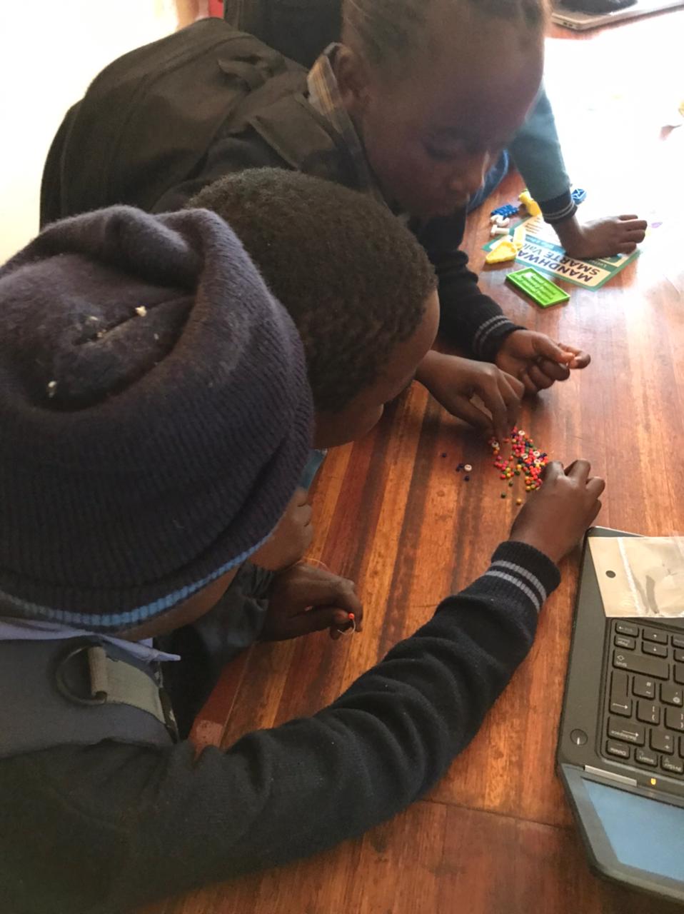 Young learners engaged in digital literacy